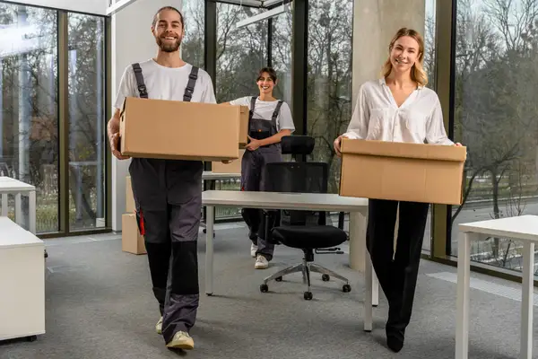 Office clearance service team in Sale removing desks, chairs, and old office equipment