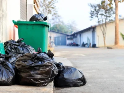 Clearance of Plastic Storage Bins in Sale – Quick & Eco-Friendly Collection Plastic storage bins stacked for clearance and removal at a residential property in Sale