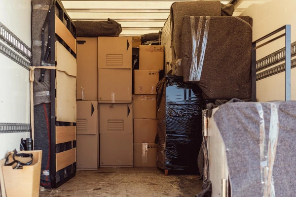 Local garage clearance team in Sale removing unwanted items from a residential garage