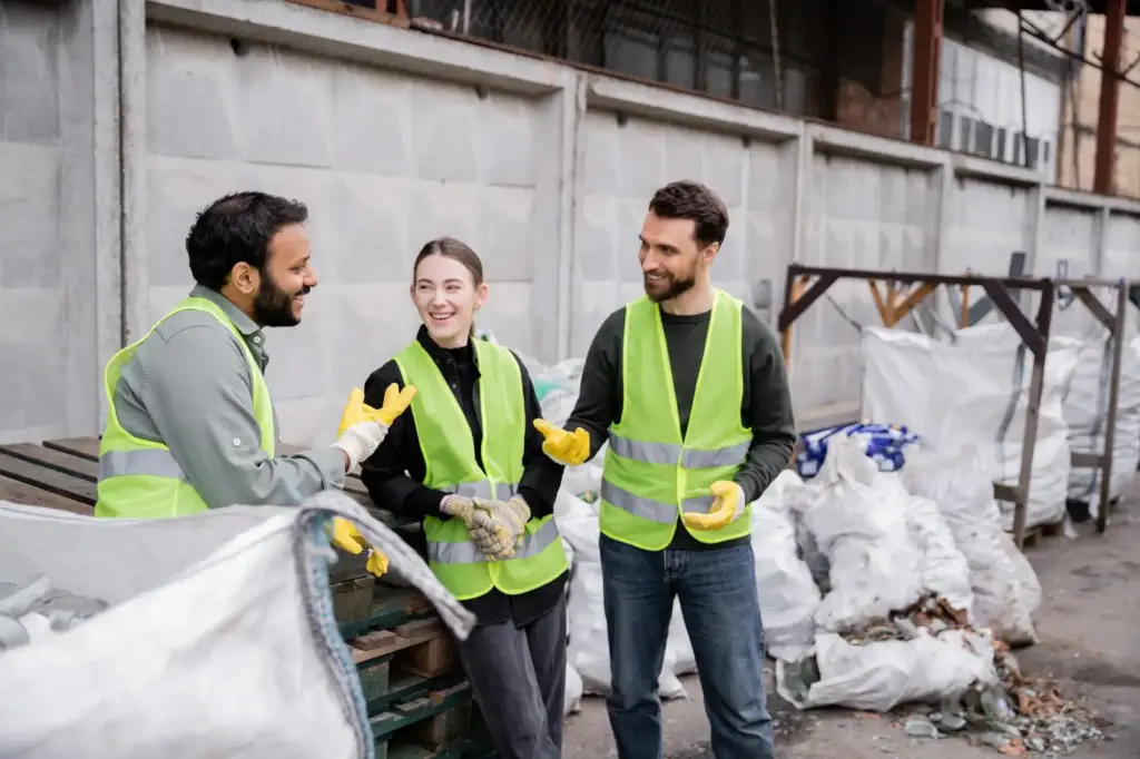 Happy local customers shaking hands with a rubbish removal expert in Sale